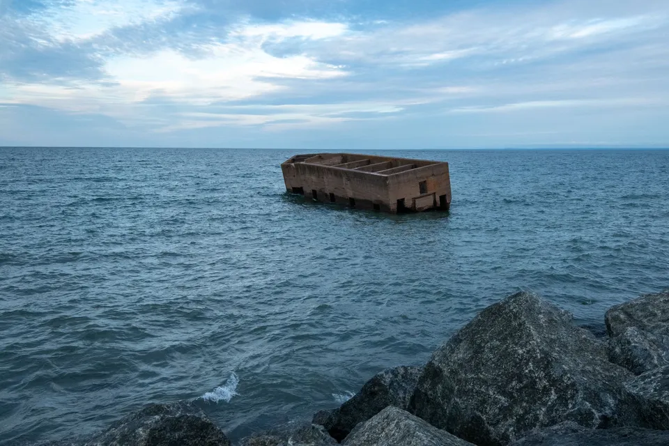 An old concrete structure floats near the shore of Lake Superior in Duluth, Minnesota.