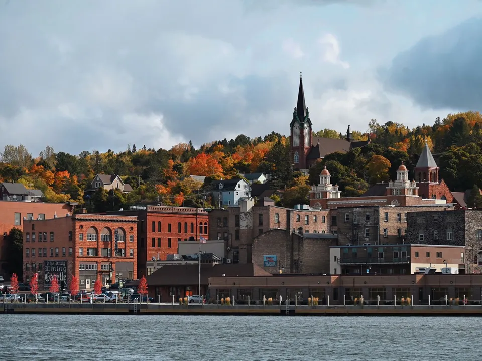 Charming downtown Duluth with fall foliage and historic buildings along the lakeshore.